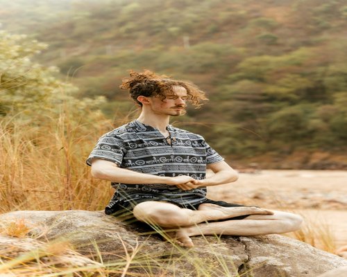 A person practicing yoga for mental peace and body relaxation